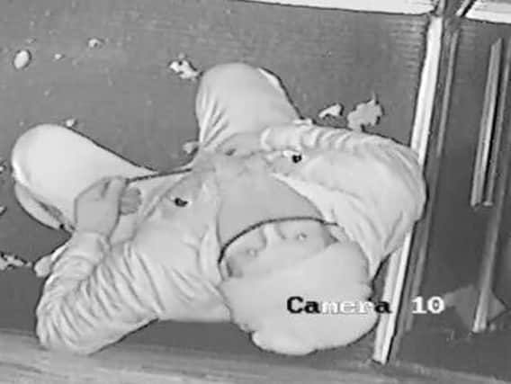 This image of the burglar was captured on CCTV cameras at Soosi Mediterranean Grill in Oakwood.