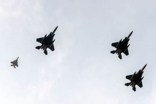 F-15s seen from Endcliffe Park in Sheffield, as warplanes from Britain and the United States stage a flypast tribute to ten US airmen 75 years after they were killed.