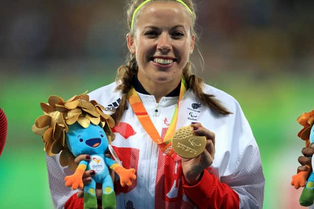 Great Britain's Hannah Cockroft poses with her gold medal from the Women's 400 metres T34 Final.