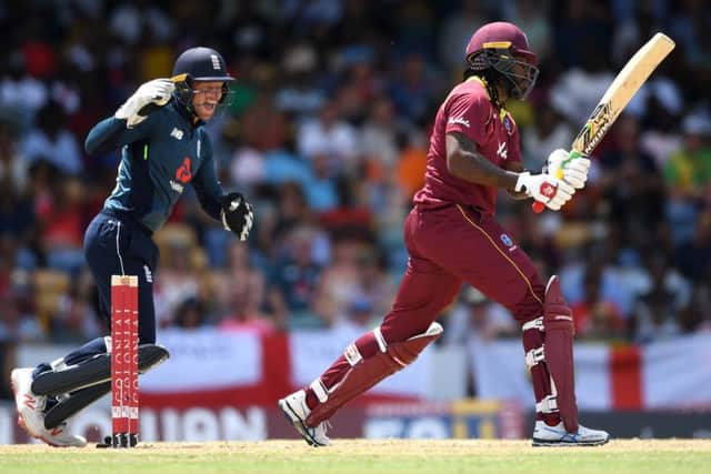 GOT HIM: Chris Gayle is bowled by Adil Rashid during the 2nd One Day International at Kensington Oval. Picture: Gareth Copley/Getty Images.