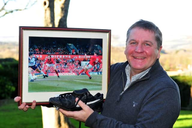 John Hendrie poses with a picture of THAT goal for Middlesbrough at Ayresome Park back in April 1995. Picture: Gerard Binks