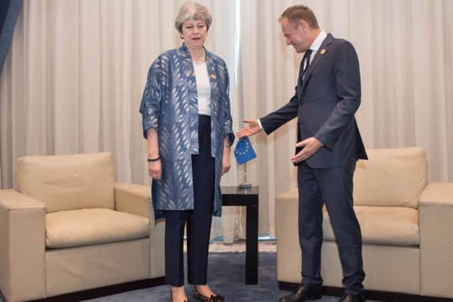 Prime Minister Theresa May meets with EU Council President Donald Tusk at the EU-League of Arab States Summit in Sharm El-Sheikh, Egypt.