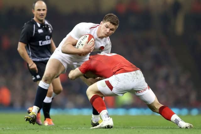 England's Owen Farrell (left) finds his path blocked at the Principality Stadium. Picture: David Davies/PA
