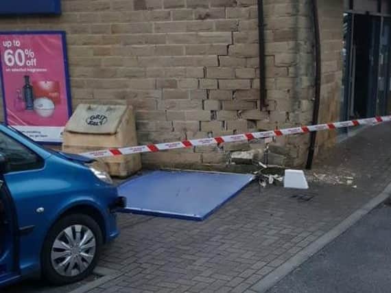 The crash damaged the wall of Boots in Guiseley