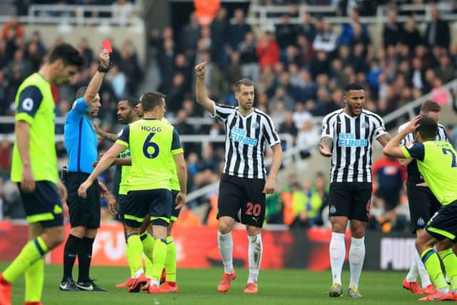 Huddersfield Town's Tommy Smith (far right) is shown a red card against Newcastle on Saturday. Picture: Owen Humphreys/PA