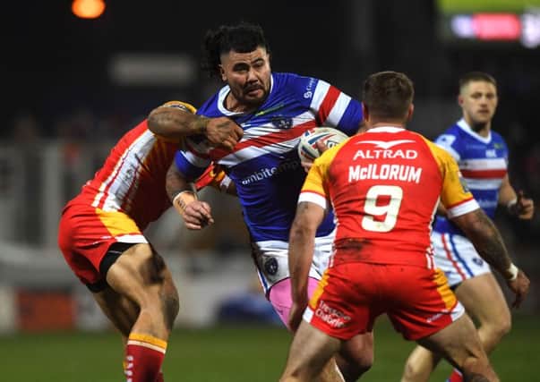 Wakefield's David Fifita is tackled by Catalans' Sam Moa and Michael McIlorum.
 Picture: Jonathan Gawthorpe
