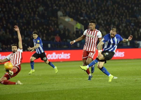Steve Fletcher scores the first of his two goals for Sheffield Wednesday against Brentford last night (Picture: Steve Ellis).