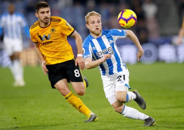 Huddersfield Town's Alex Pritchard (right) and Wolverhampton Wanderers' Ruben Neves (Picture: PA)