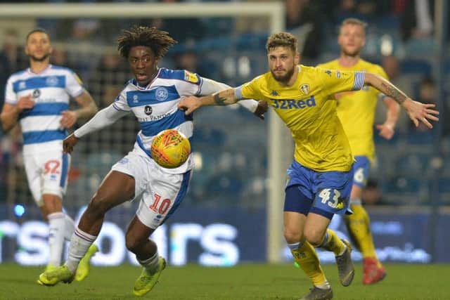 Ebere Eze and Mateusz Klich chase the ball during 
Queens Park Rangers' win over Leeds United. (Picture: Bruce Rollinson)