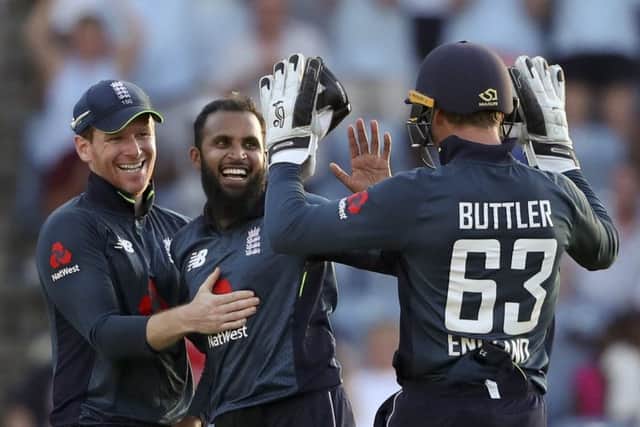 Star turn: England's Adil Rashid celebrates on his way to a five-wicket return.