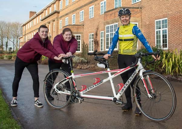 Catherine Dixon, chief executive of Askham Bryan College near York, pictured with college students, as she prepares to leave the college and set out on a world-record attempt around the world on a tandem bike ride.