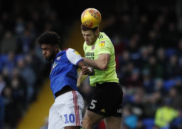 Sheffield United's Jack O'Connell rises to get the better of Ipswich Town's Ellis Harrison (Picture: Simon Bellis/Sportimage).