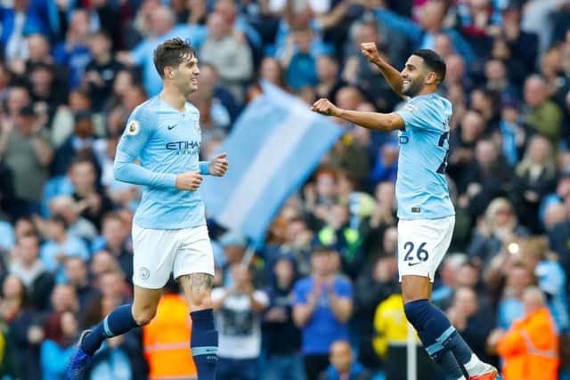 SUPERSTAR: John Stones, left, Stephen Hoyle's former Barnsley academy team-mate, in action for Manchester City. Picture: Martin Rickett/PA
