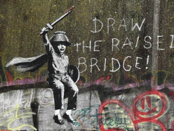 The Banksy graffiti on the Scott Street bridge