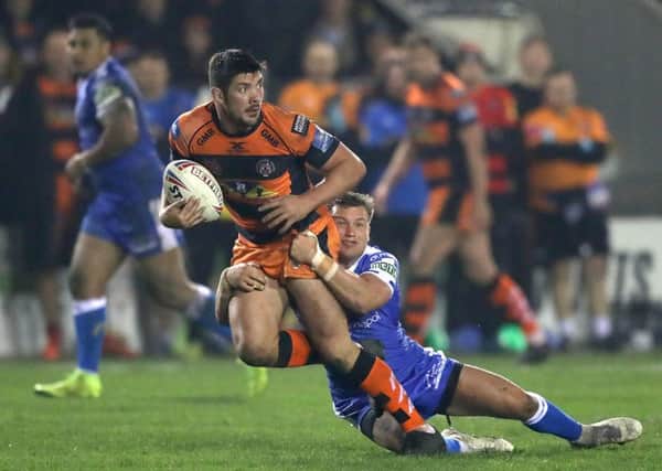 Castleford Tigers' Chris Clarkson (left) is tackled during Friday night's win over Hull KR. Picture: Simon Cooper/PA