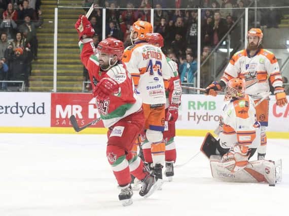 Sean Bentivoglio turns to celebrate Evan Mosey's 33rd-minute goal against Sheffield Steelers on Sunday night. Picture courtesy of Helen Brabon/EIHL.