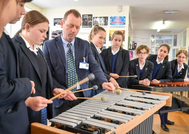 What can be done to enhance school music lessons?