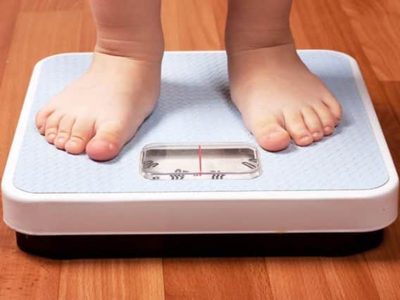 Childhood obesity in Leeds is going down, one report claims.