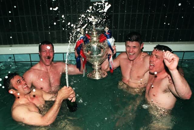Mark Aston in the Wembley bath after Sheffield's Challenge Cup final success over Wigan in 1998.