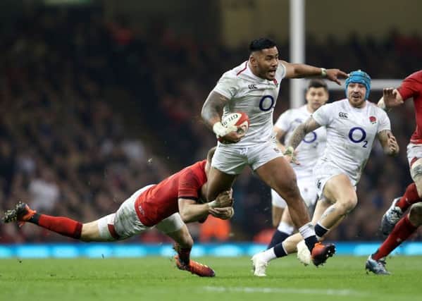 England's Manu Tuilagi is tackled by Wales' Liam Williams during the Six Nations match in Cardiff last month (Picture: David Davies/PA Wire).