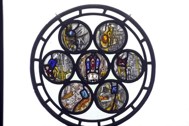 A roundel depicting the art of making a stained glass window designed, painted and made by Jonathan when he was an apprentice. PIC: Tony Johnson