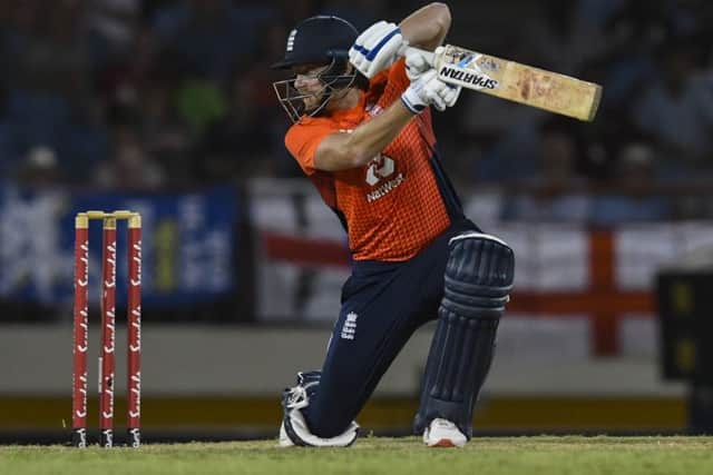 Jonny Bairstow of England hits a four during a T20 match between the West Indies and England at Darren Sammy Cricket Ground in Gros Islet (Picture: Randy Brooks / AFP/Getty Images)