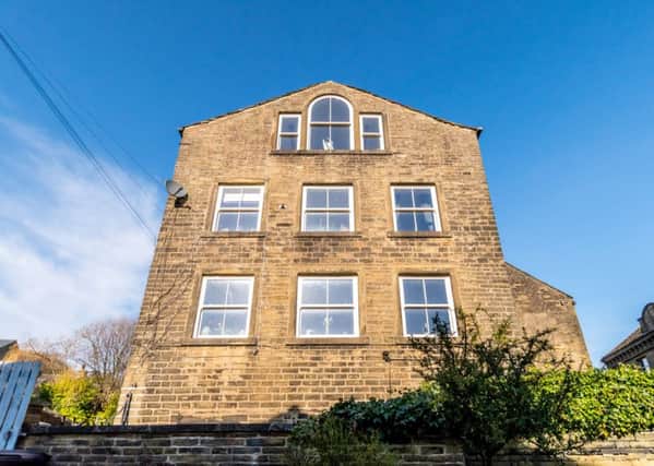 This stunning house on Oldham Road, Riponden, is filled with light and views thanks to an abundance of windows.