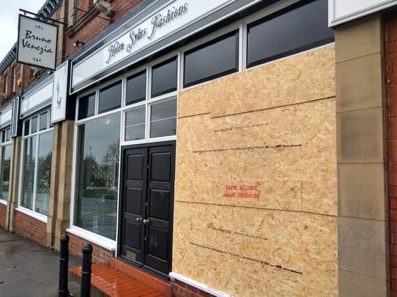 The front of the store in Leeds is now boarded up after a ram-raid on Wednesday night.