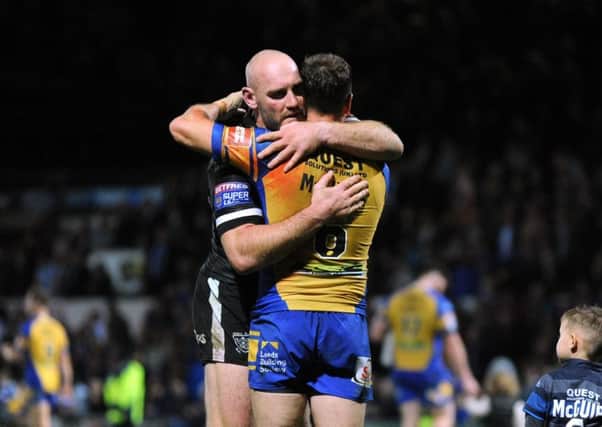 Gareth Ellis and Dannyy McGuire embrace at the end of the Super League semi-final clash at Headingley in September 2017.  Picture: Bruce Rollinson