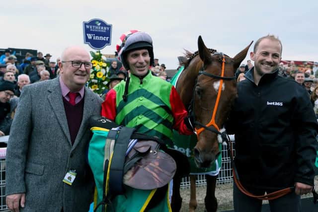 Winners: Owner Phil Martin, left, after Definitly Red won the Charlie Hall Chase.