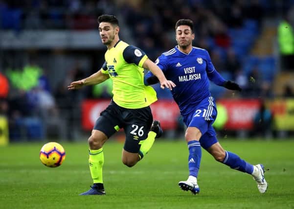 LEADER: Huddersfield Town's Christopher Schindler (left)  battles for the ball with Cardiff City's Victor Camarasa. Picture: Nick Potts/PA