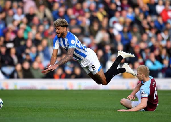 FLYING HIGH: Huddersfield Town's Philip Billing, left, should blossom if he remains in the Premier League. Picture: Anthony Devlin/PA.
