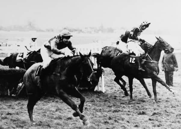 Richard Guest and Beech Road (left) clear the last in the 1989 Champion Hurdle.