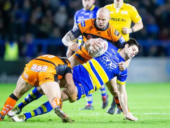 Warrington Wolves' Jake Mamo is brought down by Castleford's Nathan Massey and Paul McShane. (Allan McKenzie/SWPix)