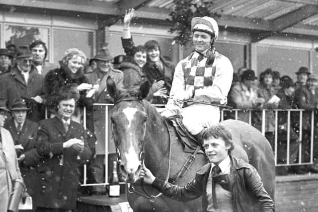 Jonjo O'Neill on Alverton is led into the winner's enclosure after winning the Gold Cup at Cheltenham in the snow.