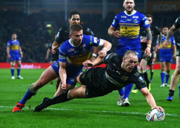 Dean Hadley of Hull FC scores a try.