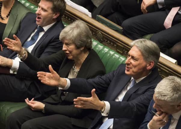 Theresa May and Philip Hammond during a Brexit debate.