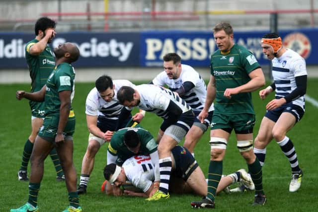 Carnegie's Peter Lucock scores the opening try and is congratulated by his team. Picture Jonathan Gawthorpe
