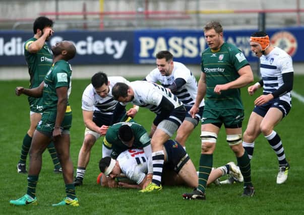 Carnegie's Peter Lucock scores the opening try and is congratulated by his team. Picture Jonathan Gawthorpe