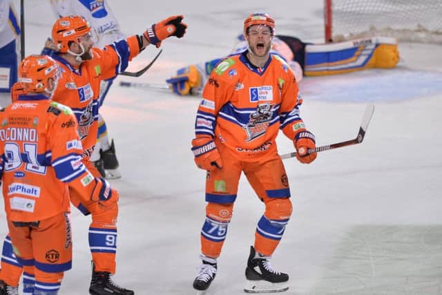 Robert Dowd, right, celebrates his and Sheffield's opener against Fife on SAturday night. Picture: Dean Woolley.