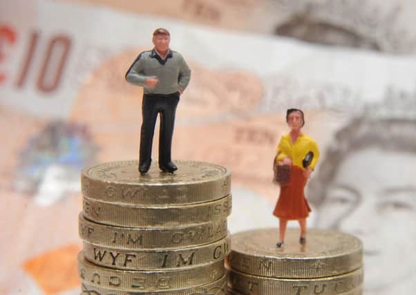 File photo dated 27/01/15 of plastic models of a man and woman standing on a pile of coins and bank notes. Nearly eight out of 10 companies and public sector bodies pay men more than women as the deadline passed for organisations to report their gender pay gaps. PRESS ASSOCIATION Photo. Issue date: Thursday April 5, 2018. Businesses with 250 employees or more were required to submit the data on mean and median gender pay gaps to the Government Equalities Office by midnight on Wednesday. See PA story INDUSTRY GenderPay. Photo credit should read: Joe Giddens/PA Wire