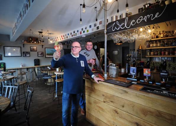Feature on Chapeltown Tap House and Gin Bar, Chapeltown, Sheffield..Richard Colton (left) and Darrel Johnson pictured in the  bar..8th February 2019.Picture by Simon Hulme