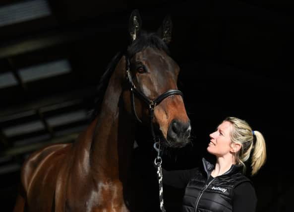 Trainer Kayley Woollacott with her Arkle hopeful Lalor who was acquired by her late husband Richard.
