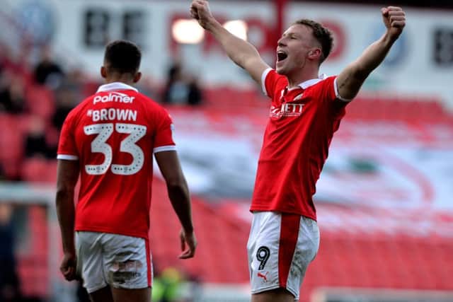 Cauley Woodrow celebrates scoring for Barnsley against Wycombe Wanderers last month. Woodrow scored both goals as Barnsley won 2-1 (Picture: Bruce Rollinson).