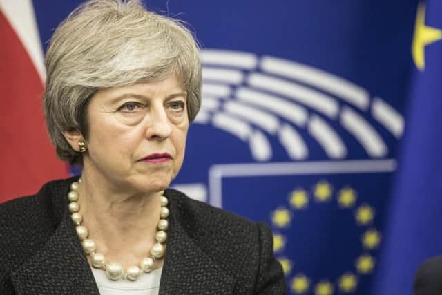 Theresa May - pictured as she delivered a statement at Strasbourg on Monday night.