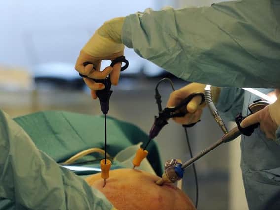 Surgical's instruments being used in a gallbladder removal