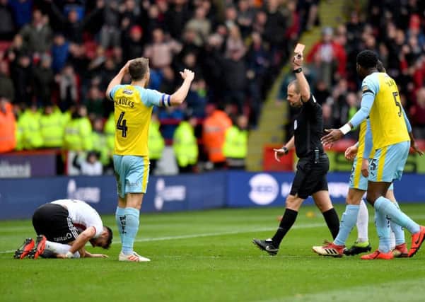 Rotherham United's Will Vaulks is dismayed after receiving a red card following a challenge on Sheffield United's George Baldock on Saturday (Picture: Anthony Devlin/PA Wire).