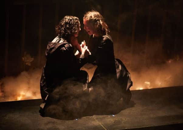 Simona Bitmate as Ophelia and Tessa Parr as Hamlet in Leeds Playhouses production of the Shakespeare tragedy.