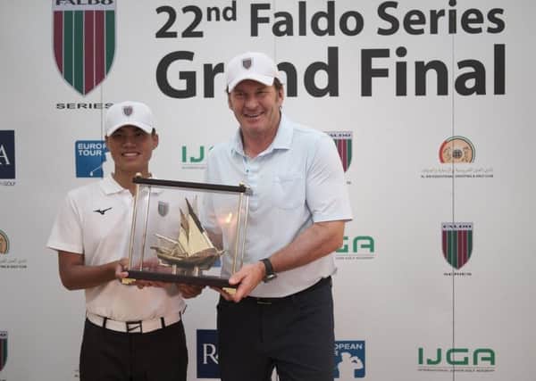Sir Nick Faldo presents 2018 Faldo Series winner Chen Ting-Yu with the trophy.