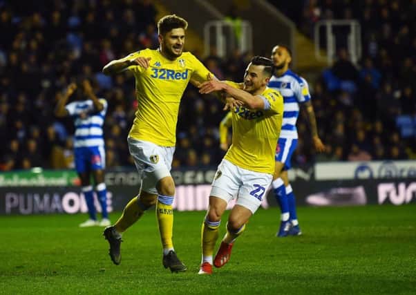 Leeds United's Mateusz Klich celebrates with Jack Harrison after opening the scoring in the win at Reading (Picture: Jonathan Gawthorpe).